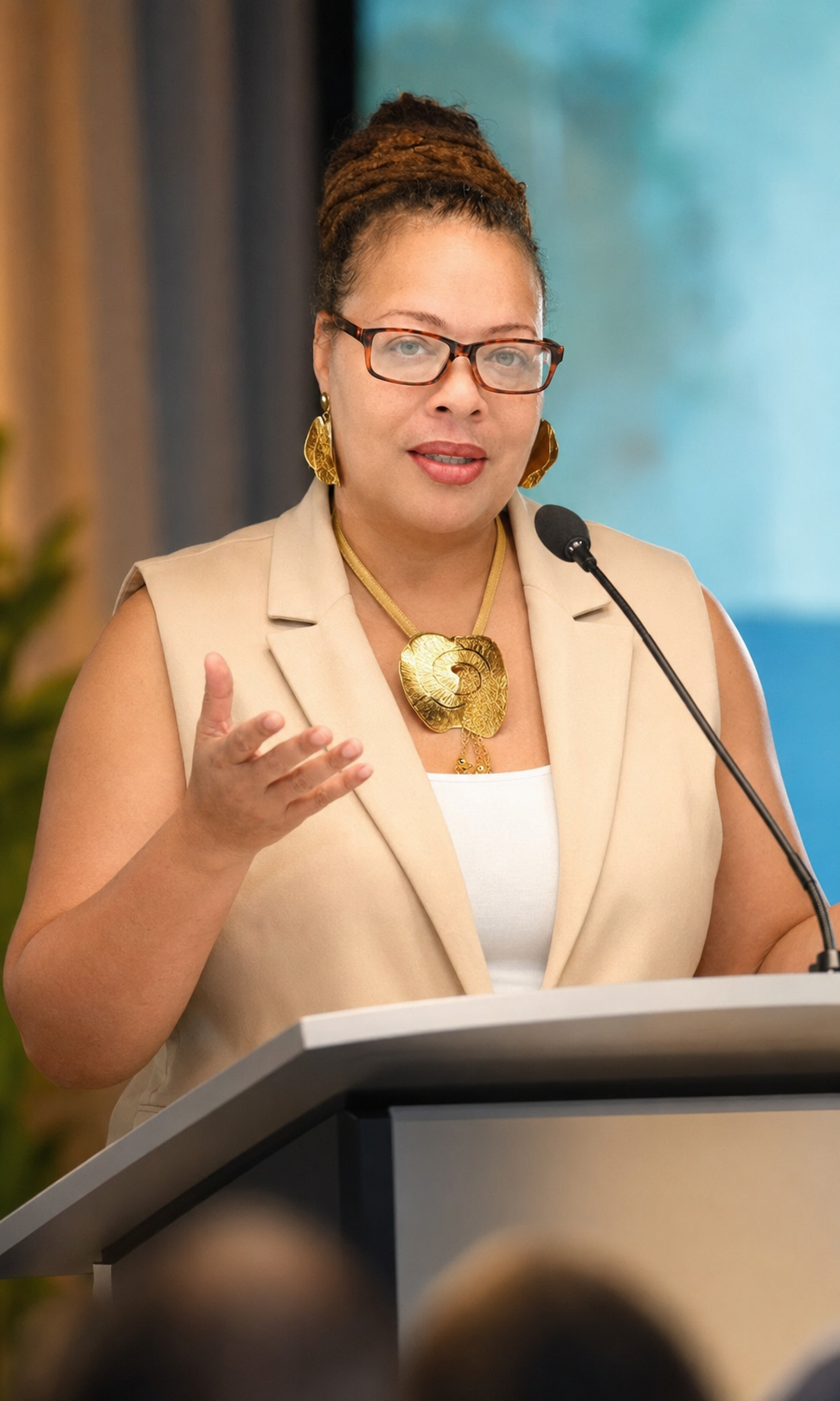 Tomika McFadden speaking at a podium